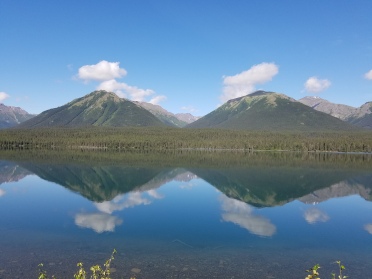 Mirror surface of a lake in Iskut, British Columbia.